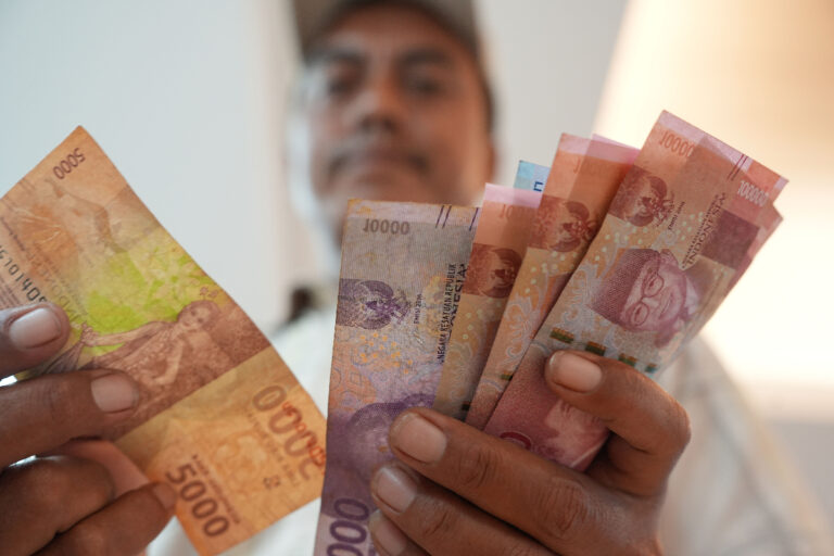 Indonesian rupiah in hand